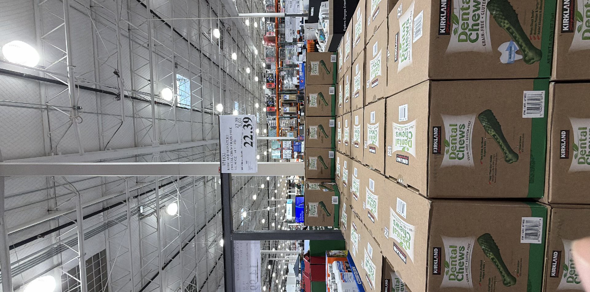 Bulk boxes of pickles stacked high on a warehouse floor